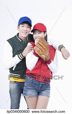 Stock Image - Baseball supporters with baseball equipment. Fotosearch