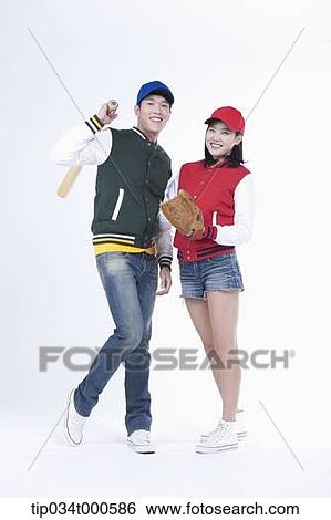 Stock Photograph - Baseball supporters with baseball equipment. Fotosearch