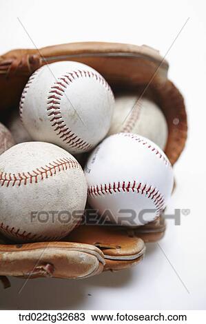 Baseballs in a glove View Large Photo Image Stock Image - Baseballs in a glove. Fotosearch