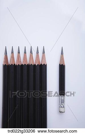 Stock Photograph - Big pencils and a small pencil. Fotosearch