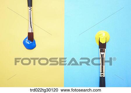 Blue paint on yellow background and yellow paint on blue background with paintbrushes View Large Photo Image Stock Image - Blue paint on yellow background and yellow paint on blue background with paintbrushes. Fotosearch
