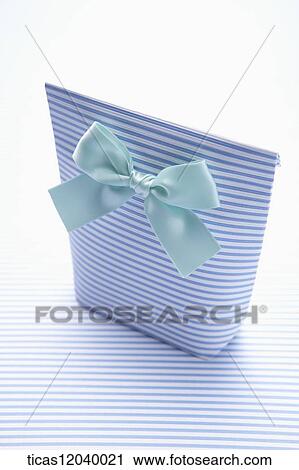 Blue stripe gift bag with blue ribbon View Large Photo Image Stock Image - Blue stripe gift bag with blue ribbon . Fotosearch