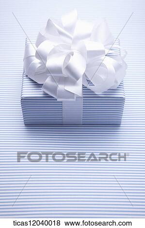 Stock Photo - Blue stripe gift box with white ribbon . Fotosearch