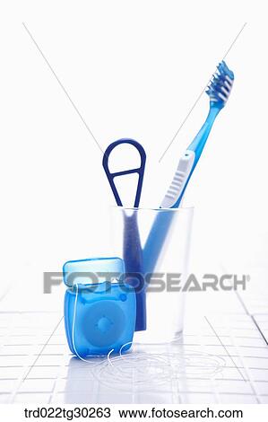 Blue tooth brush, tongue cleaner in cup and floss View Large Photo Image Stock Image - Blue tooth brush, tongue cleaner in cup and floss. Fotosearch
