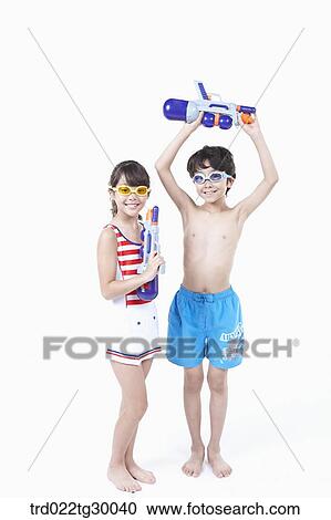 boy and girl are holding water guns View Large Photo Image Stock Image - boy and girl are holding water guns . Fotosearch