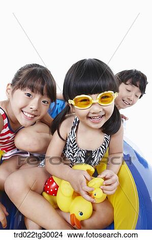 Picture - boy and girls are on the boat. Fotosearch