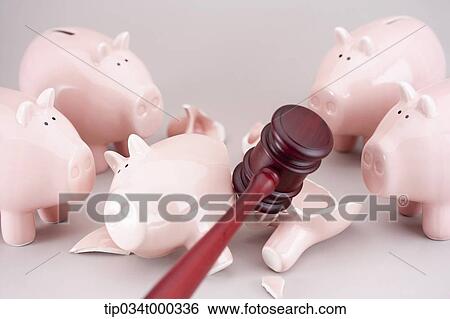 Breaking the piggy bank with the gavel View Large Photo Image Stock Photograph - Breaking the piggy bank with the gavel. Fotosearch