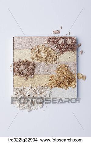 Picture - Brown and gold tone eye shadow. Fotosearch