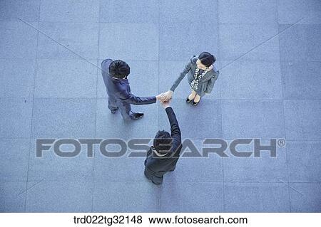 Business partners putting hands together View Large Photo Image Stock Photo - Business partners putting hands together. Fotosearch
