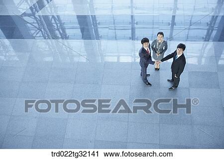 Business partners shaking hands together View Large Photo Image Stock Image - Business partners shaking hands together. Fotosearch