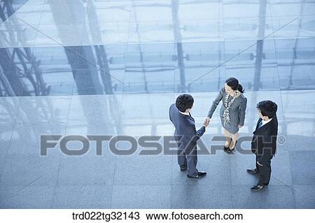 Business partners shaking hands together View Large Photo Image Stock Image - Business partners shaking hands together. Fotosearch