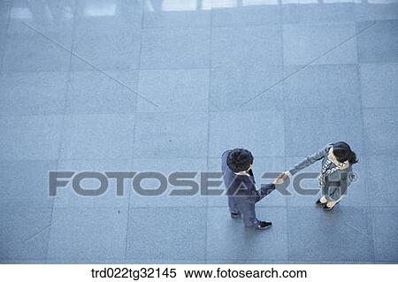 Business partners shaking hands together View Large Photo Image Stock Photography - Business partners shaking hands together. Fotosearch