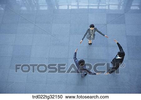 Stock Image - Business partners with their arms open. Fotosearch
