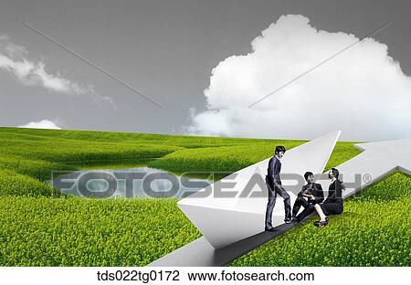 Stock Image - business people are sitting on the grass. Fotosearch