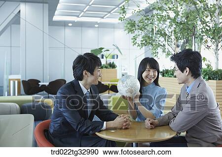 Businessmen having a talk with the globe View Large Photo Image Stock Image - Businessmen having a talk with the globe. Fotosearch