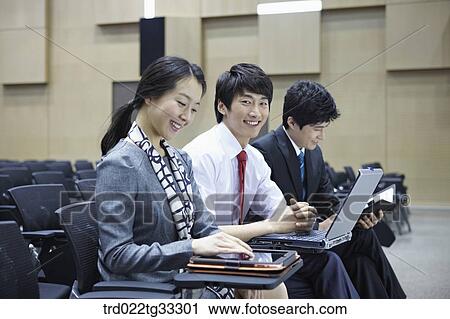 Businessmen listening to the seminar in the auditorium View Large Photo Image Stock Image - Businessmen listening to the seminar in the auditorium. Fotosearch
