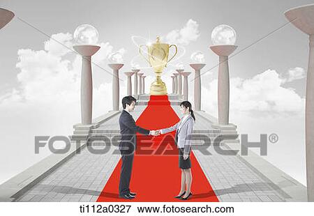 Businessmen shaking hands with golden trophy View Large Photo Image Stock Photo - Businessmen shaking hands with golden trophy. Fotosearch