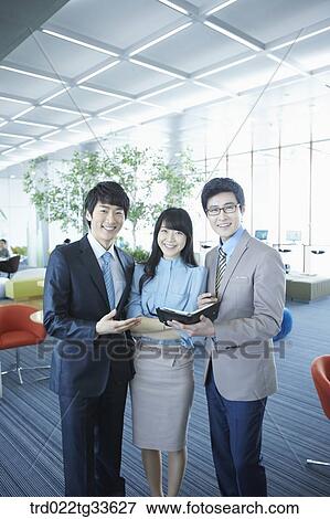Businessmen smiling with the planner View Large Photo Image Stock Photo - Businessmen smiling with the planner. Fotosearch