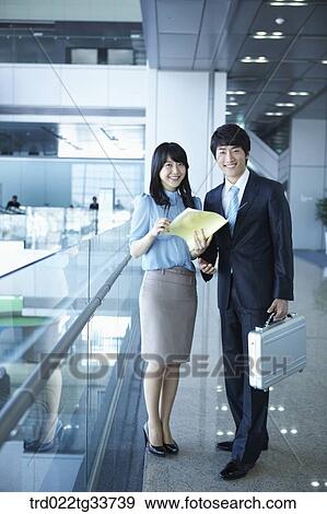 Businessmen with the file and briefcase View Large Photo Image Stock Photo - Businessmen with the file and briefcase. Fotosearch
