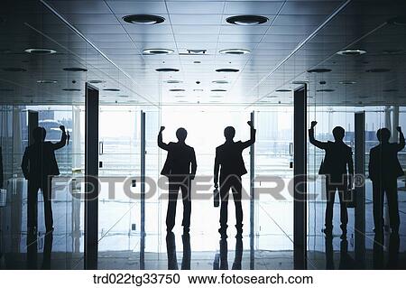 Cheerful businessmen in the hallway View Large Photo Image Stock Image - Cheerful businessmen in the hallway. Fotosearch