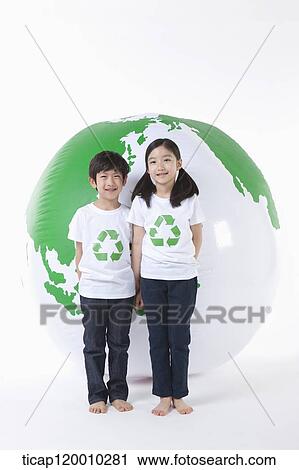 Children in recycling shirt and a green globe View Large Photo Image Stock Image - Children in recycling shirt and a green globe. Fotosearch