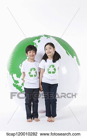 Children in recycling shirt and a green globe View Large Photo Image Stock Image - Children in recycling shirt and a green globe. Fotosearch