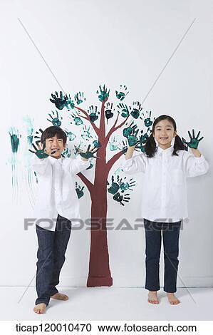 Children painting the tree with hands View Large Photo Image Stock Image - Children painting the tree with hands. Fotosearch