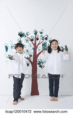 Children painting the tree with hands View Large Photo Image Stock Image - Children painting the tree with hands. Fotosearch