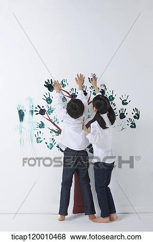 Children painting the tree with hands View Large Photo Image Stock Photo - Children painting the tree with hands. Fotosearch
