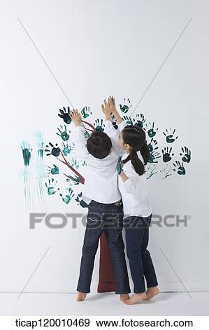 Children painting the tree with hands View Large Photo Image Stock Photo - Children painting the tree with hands. Fotosearch