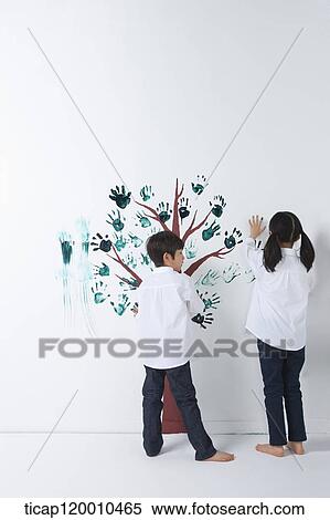Children painting the tree with hands View Large Photo Image Stock Photography - Children painting the tree with hands. Fotosearch