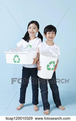 Children smiling with recycling bin View Large Photo Image Stock Photo - Children smiling with recycling bin . Fotosearch