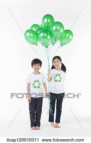 Children wearing recycling shirt with green balloons View Large Photo Image Stock Image - Children wearing recycling shirt with green balloons. Fotosearch