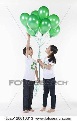 Children wearing recycling shirt with green balloons View Large Photo Image Stock Image - Children wearing recycling shirt with green balloons. Fotosearch