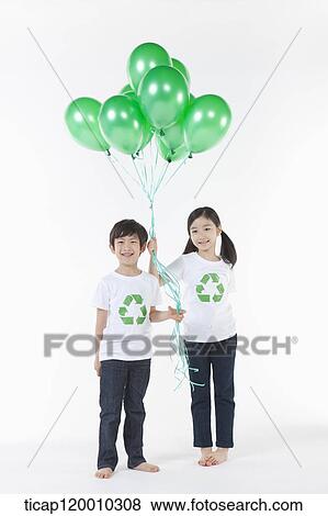 Children wearing recycling shirt with green balloons View Large Photo Image Stock Photo - Children wearing recycling shirt with green balloons. Fotosearch