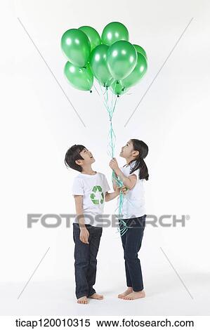 Children wearing recycling shirt with green balloons View Large Photo Image Stock Photography - Children wearing recycling shirt with green balloons. Fotosearch