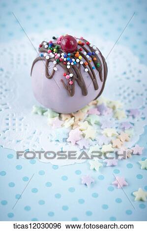 Stock Photograph - Chocolate ball with colorful decoration . Fotosearch