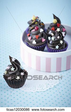 Chocolate cupcake in pink gift box View Large Photo Image Stock Photograph - Chocolate cupcake in pink gift box. Fotosearch