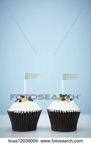 Chocolate cupcake with blue flag View Large Photo Image Picture - Chocolate cupcake with blue flag. Fotosearch