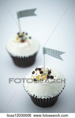Chocolate cupcake with blue flag View Large Photo Image Stock Photograph - Chocolate cupcake with blue flag. Fotosearch