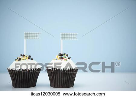 Chocolate cupcake with blue flag View Large Photo Image Stock Photography - Chocolate cupcake with blue flag. Fotosearch