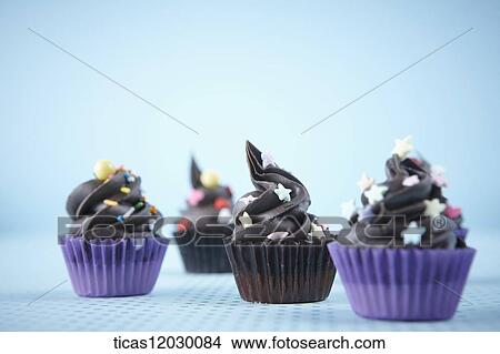 Chocolate cupcake with colorful decoration View Large Photo Image Picture - Chocolate cupcake with colorful decoration . Fotosearch