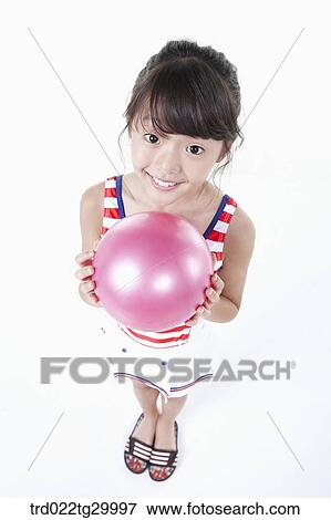 close up of girl is holding beach ball View Large Photo Image Stock Photo - close up of girl is holding beach ball. Fotosearch