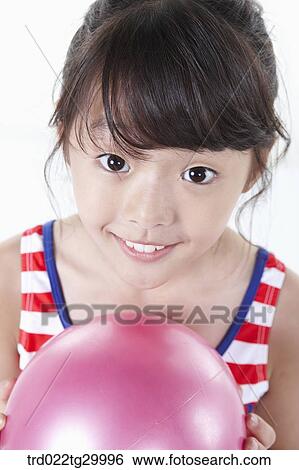close up of girl is holding beach ball View Large Photo Image Stock Photograph - close up of girl is holding beach ball. Fotosearch