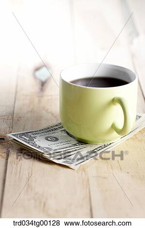 coffee on the money bills View Large Photo Image Stock Photo - coffee on the money bills. Fotosearch