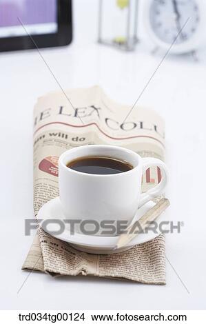 coffee on the newspaper View Large Photo Image Picture - coffee on the newspaper. Fotosearch