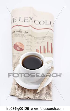 Stock Photography - coffee on the newspaper. Fotosearch