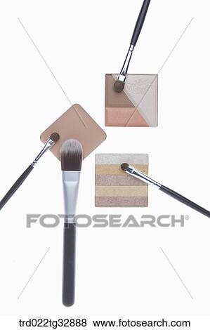 Stock Photo - Colorful eye shadow and cosmetic brush. Fotosearch