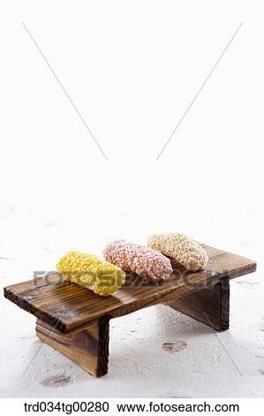 Stock Image - Colorful Korean dessert on the wooden dish . Fotosearch