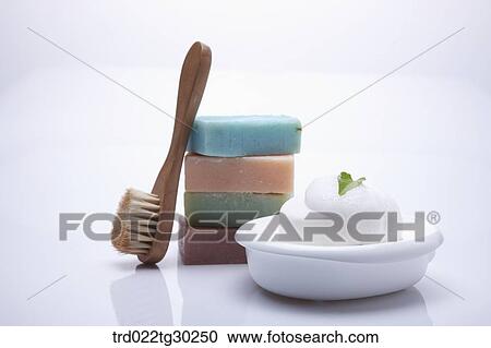 Colorful pile of soaps, bath brush and soap with foam View Large Photo Image Stock Image - Colorful pile of soaps, bath brush and soap with foam . Fotosearch